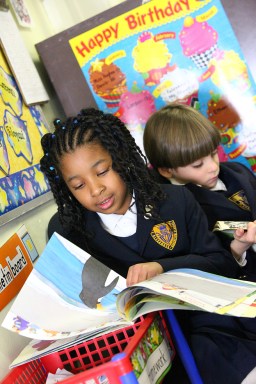 PRIMARY PHOTO_ARS two kids reading_photo by Jim Healy