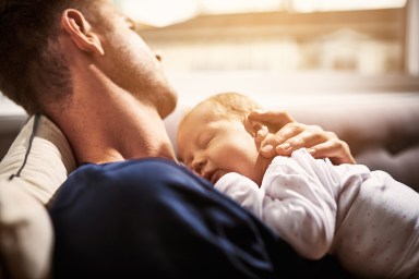 dad with sleeping baby