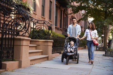 Family taking a walk down the street, close up