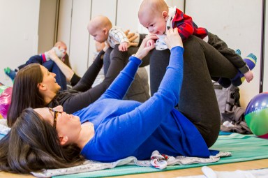 mother and baby doing yoga