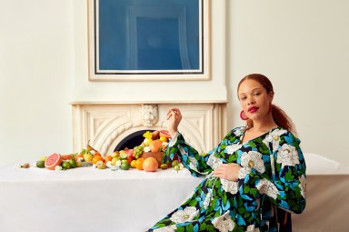 pregnant woman in high fashion green dress