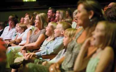 children in the audience at the theater