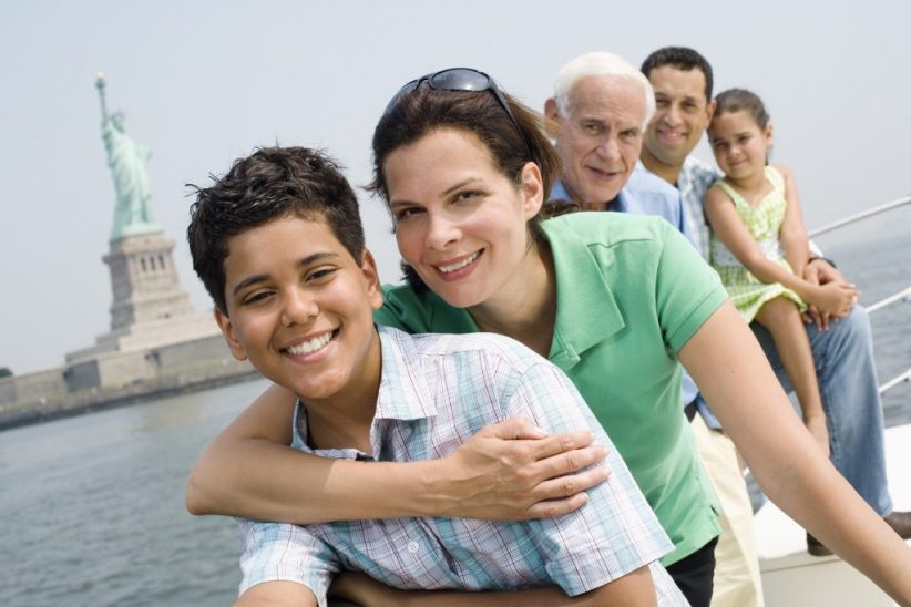 Family Touring New York Near Statue of Liberty National Monument