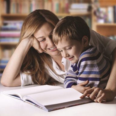 mother and child reading a book together