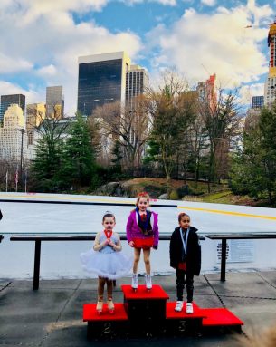 three girls at figure skating competition