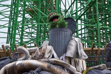 oscar the grouch on a roller coaster