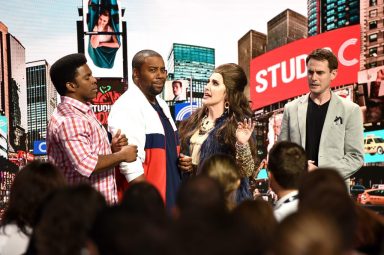 kenan thompson and actors in front of fake times square for studio c sketch