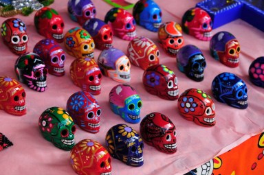 multi colored dead of the dead skulls on a table