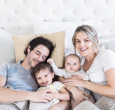 Ali Fedotowsky with family in bed