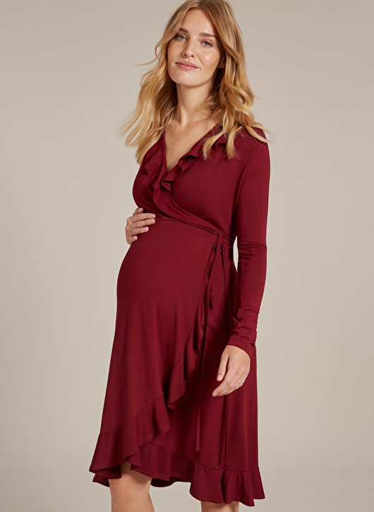 pregnant model in red wrap dress with ruffles