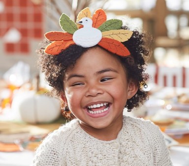 little girl wearing a thanksgiving headband