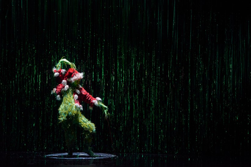 actor dressed as the grinch in a muscial of the popular christmas book