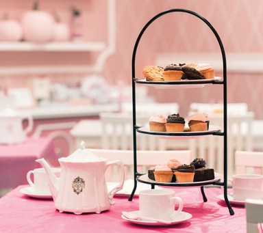 cute pink tea set with little cakes