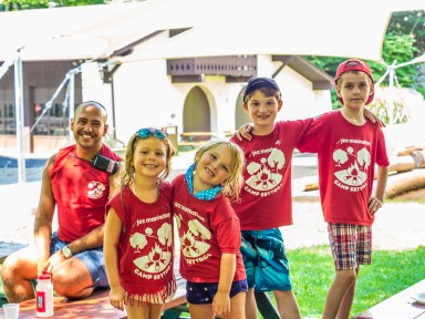 group of kids at camp wearing red shirts