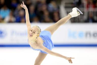 female ice skater in blue dress