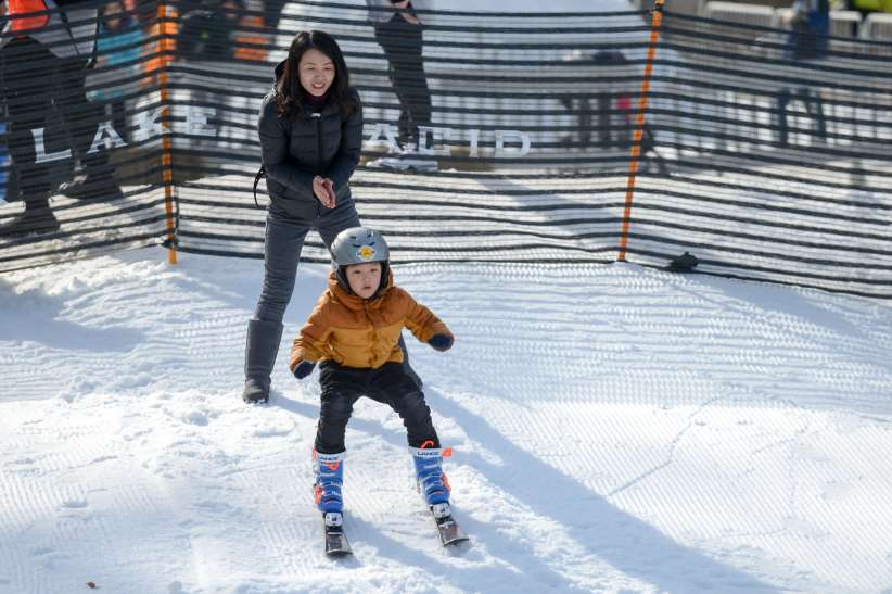 kid skiing in the snow at Winter Jam NYC