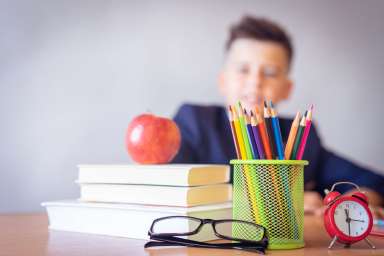 boy-looking-on-a-tidied-desk-2781814