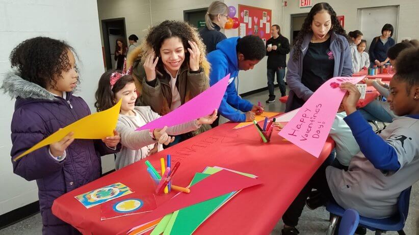 kids making crafts at a booth