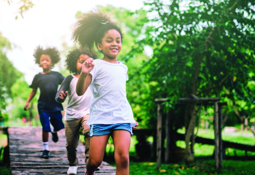 young girls running at camp