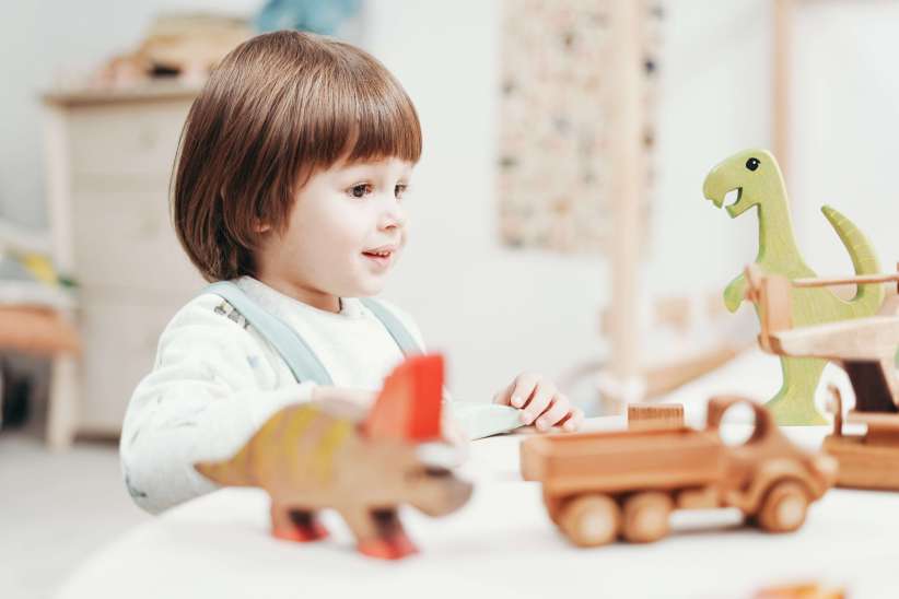 kid playing with toys