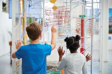 kids looking at an exhibit in a museum