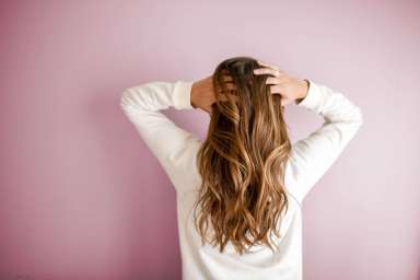 woman-wearing-white-long-sleeved-shirt-973401