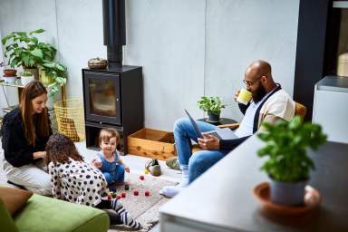 Mother and father at home wit h two daughters