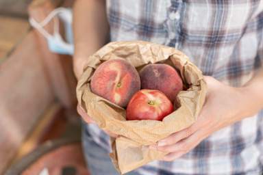 Farmer with organic peach