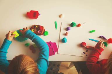 kids play with clay molding shapes