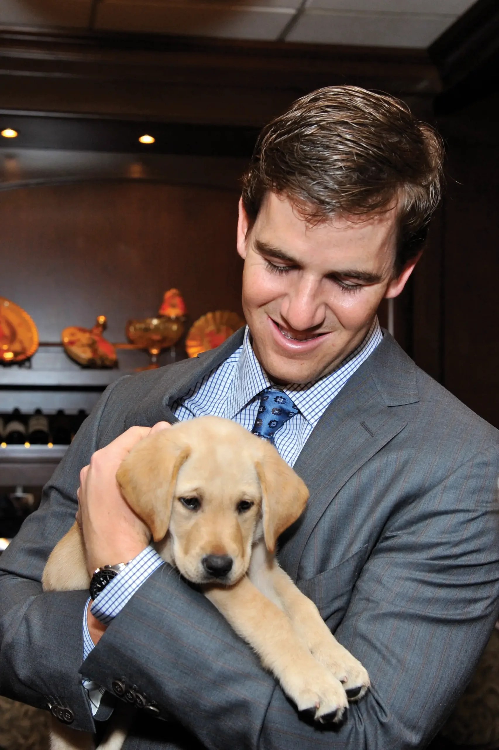 Eli Manning and puppy