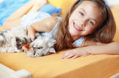 Lazy-Girl-with-Cat-in-Bed