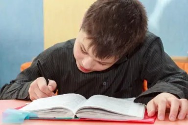 boy-at-desk-doing-homework