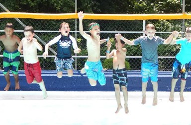 boys-jumping-into-swimming-pool