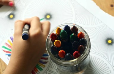 child-coloring-with-crayons