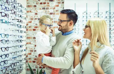 child-trying-on-glasses-cropped-right