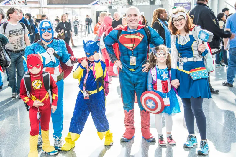 family dressed as superheroes