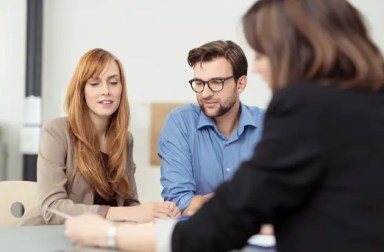 couple-with-lawyer-writing-will