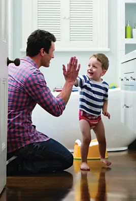 dad gives son a high five