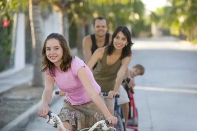 family-biking-on-street