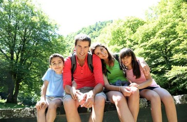 14663705 – portrait of family sitting on a bridge in forest