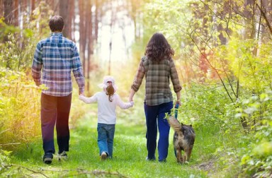 family-walking-in-woods