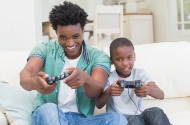 father-and-son-playing-video-games-together