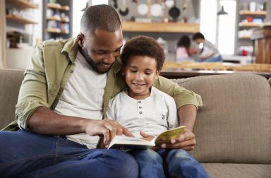 father-reading-to-son