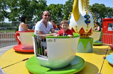 father-son-on-teacup-ride