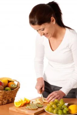 female-adult-chopping-fruit