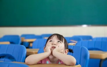 girl-at-desk-looking-up