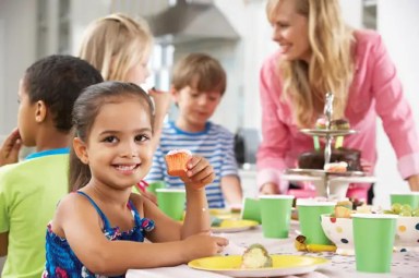 girl-at-party-with-cupcake