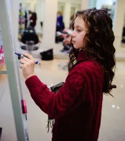 girl-writing-on-whiteboard