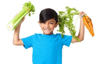 happy-boy-holding-vegetables