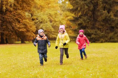 kids-in-coats-running-outside